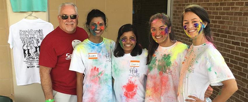 Dr. Carter with Students at Holi Fest